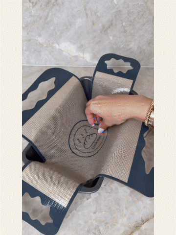 Baking mat in a loaf pan while adding batter and baking